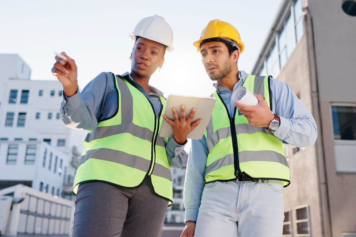 Engineers holding a tablet